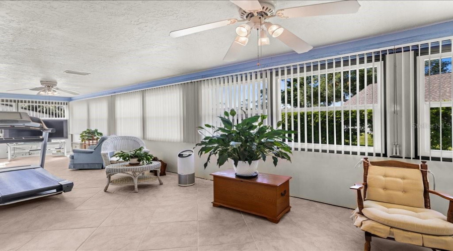 The Florida Room Has Tile Floor And Newer Windows.