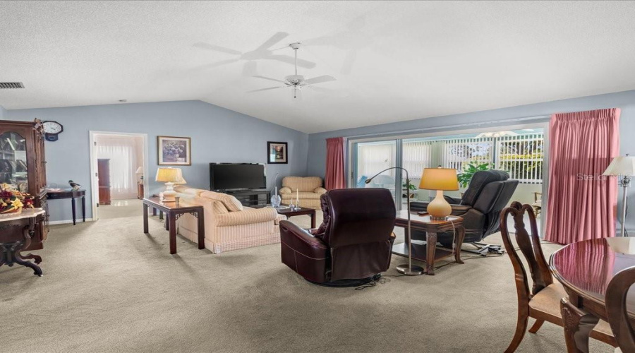 Living Room Has Vaulted Ceiling And Optional Space For Dining Area.