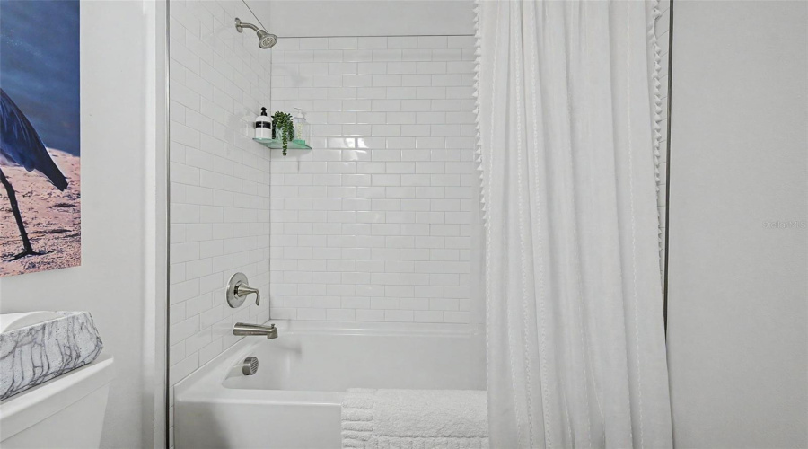 Secondary Bath With Tiled Bathtub