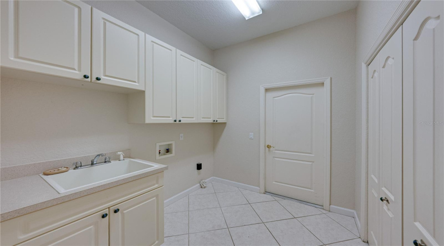 Large Inside Laundry Room With Extra Storage Closet