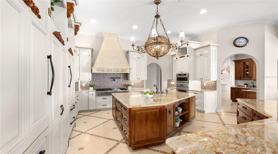 A Culinary Showpiece Featuring Extensive Custom Cabinetry And Two Sub-Zero 36-Inch Built-In, Bottom-Freezer Refrigerators.