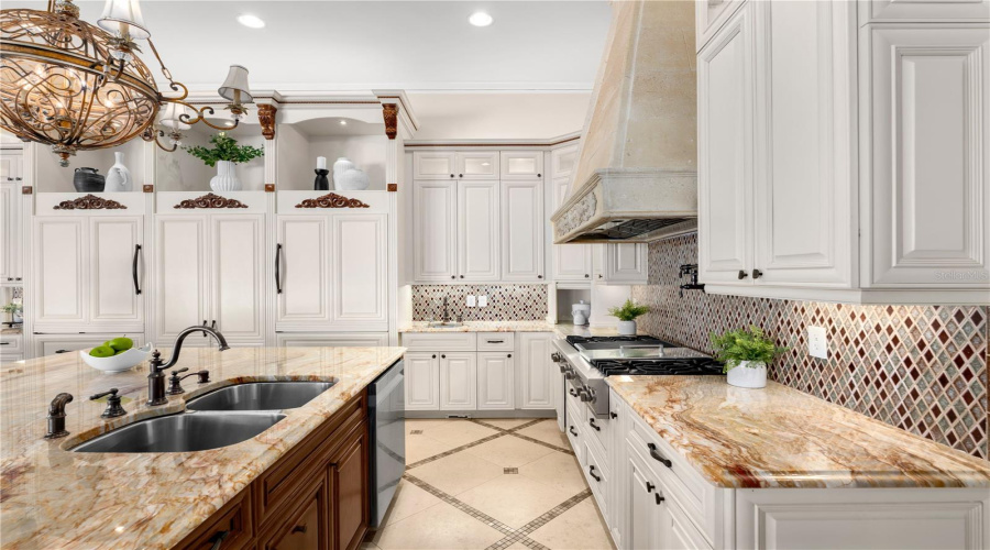 A Gourmet Kitchen Appointed With A Viking Professional Range-Top, Integrated Griddle And Grill, Custom Hood And Pot Filler.
