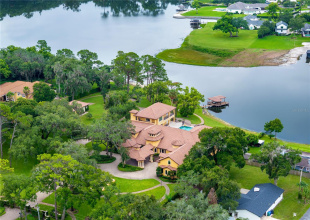A Private Lake Mary, FL Waterfront Sanctuary — this extraordinary lakefront estate delivers resort-caliber luxury, architectural distinction and rare privacy along the shores of Lake Mary in the heart of Seminole County.