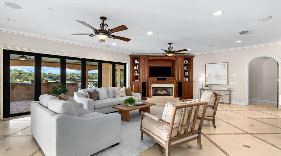 The Expansive Family Room Opens Toward The Resort-Style Grounds, Creating An Effortless Connection Between Sophisticated Interiors And Lake Mary Waterfront Living.