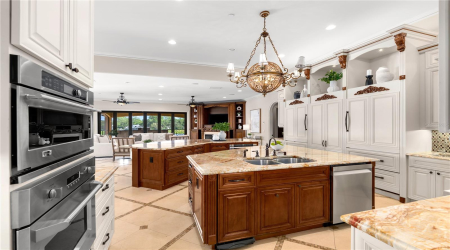 The Chef'S Kitchen Also Features Ge Monogram Ovens, An Integrated Warming Drawer And A Hidden Walk-In Pantry With Extensive Custom Shelving.