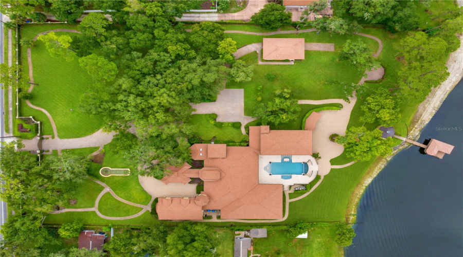 Aerial View Of This Private Lake Mary, Fl Sanctuary Reveals The Full Scale Of The Waterfront Estate, Resort-Style Grounds And Coveted Lake Mary Shoreline Setting.
