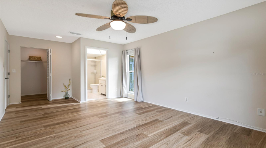 Primary Bedroom With Walk In Closet And The Ensuite Bath
