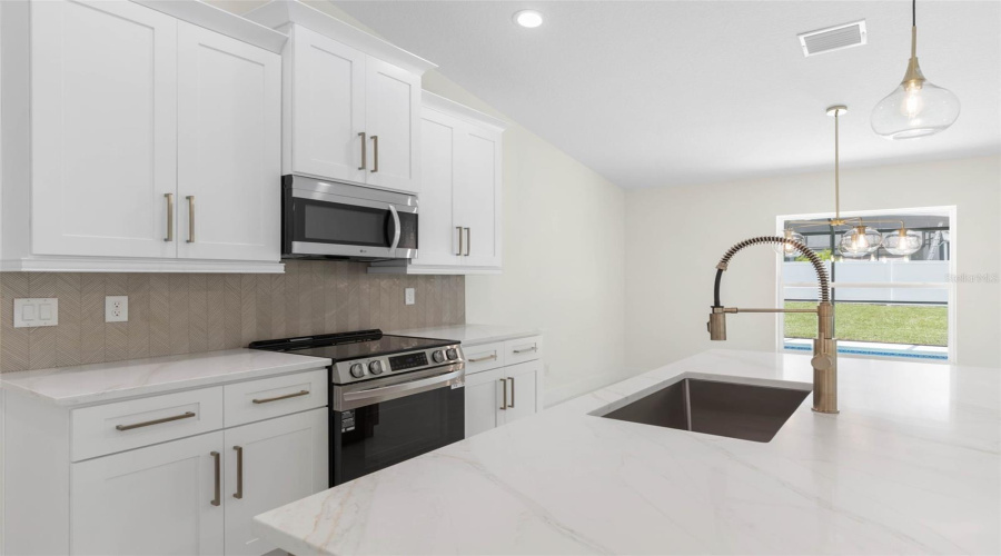 Glass Herringbone Tile Backsplash