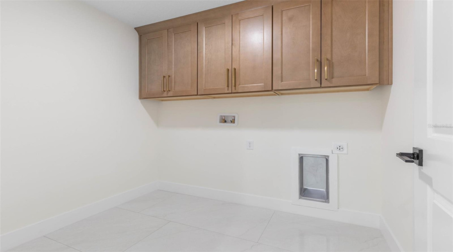 Separate Laundry Room With Built-Ins