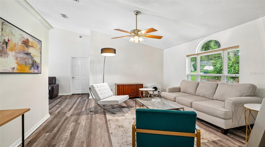 Family Room With Luxury Vinyl And Ceiling Fan, A Lot Of Natural Light.