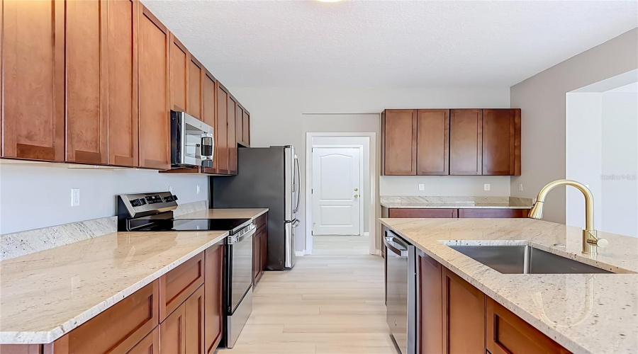 Kitchen And Walk In Pantry And Garage Door