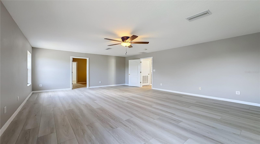Master Bedroom And Entrance To Master Bathroom And Walk In Closet
