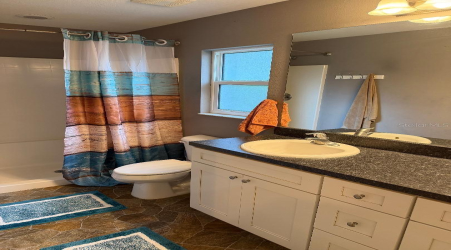 Primary Bathroom (Has Dual Sinks And Linen Closet)