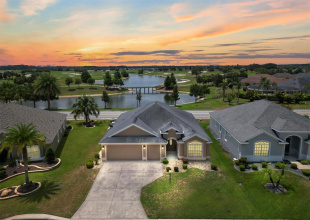 FRONT OF HOME WITH PAN0RAMIC WATER AND GOLF COURSE VIEW