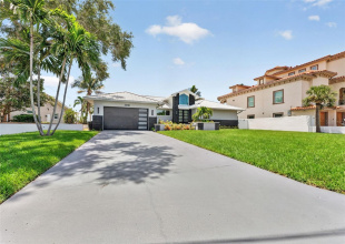Spacious parking pad just painted & re-sealed with plenty of room for guests, boats, or an RV.