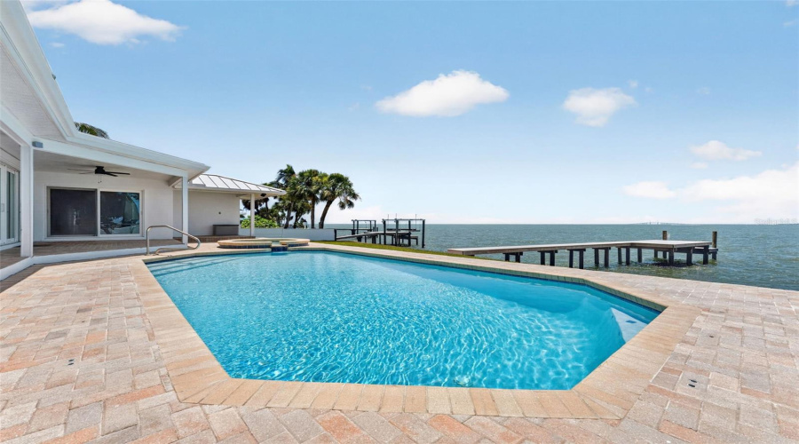 Stunning Outdoor Oasis Featuring Covered Patios, A Sparkling Pool, And A Relaxing Spa—Perfect For Entertaining Or Unwinding.