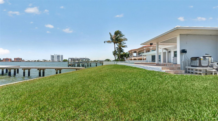 Open Green Space In The Backyard, Perfect For Outdoor Activities And Play