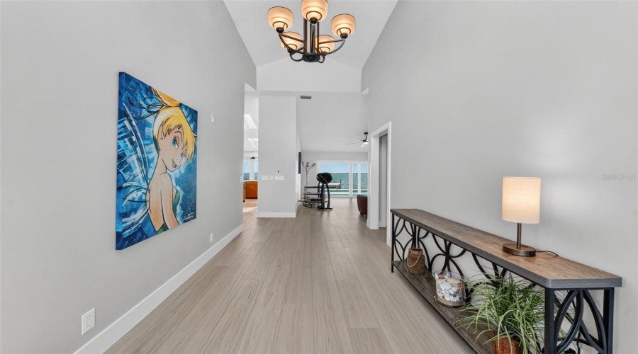 Grand Foyer With Soaring Vaulted Ceilings, Setting The Tone For The Spacious And Elegant Design Throughout The Home.