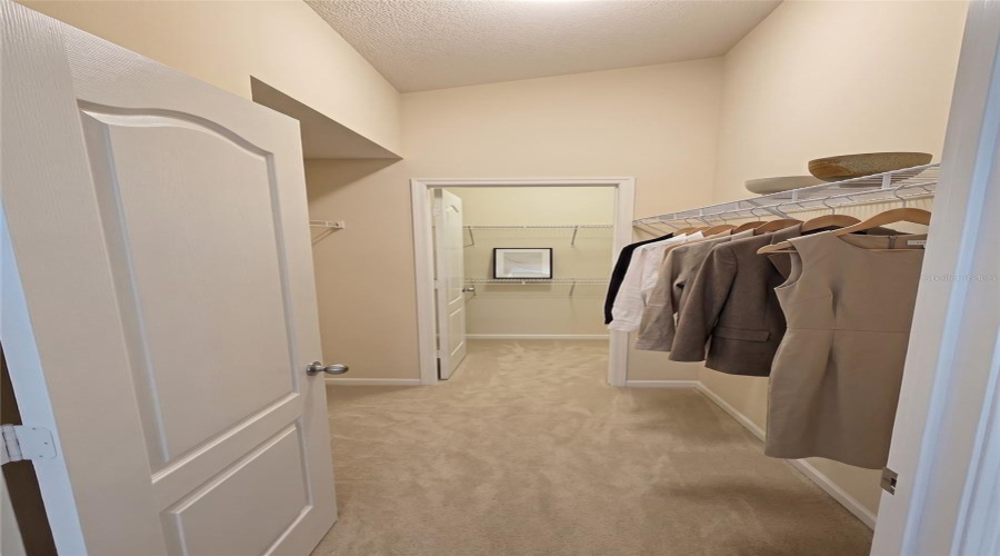 Master Walk In Closet With Lockable Owner'S Closet