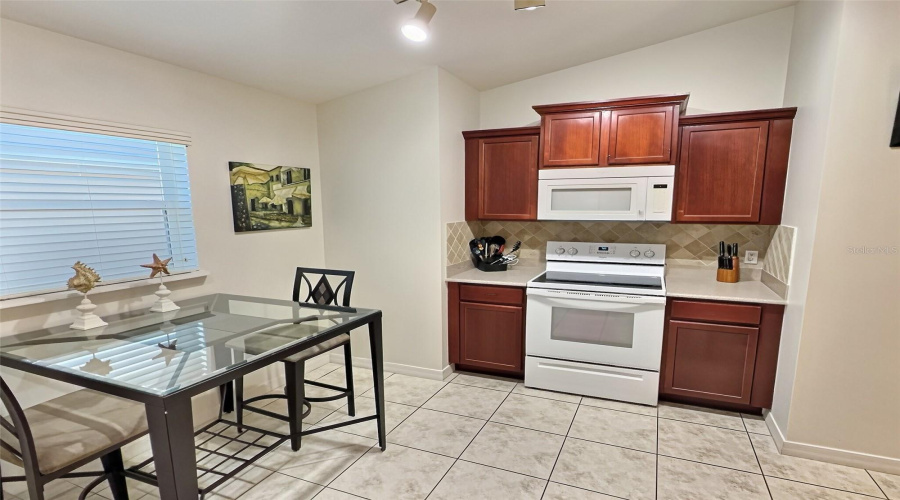 Kitchen With Eat In Area.