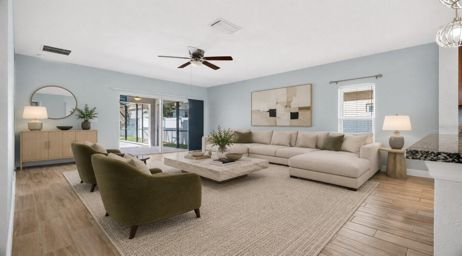 Virtually Staged Living Room Leading To The Lanai