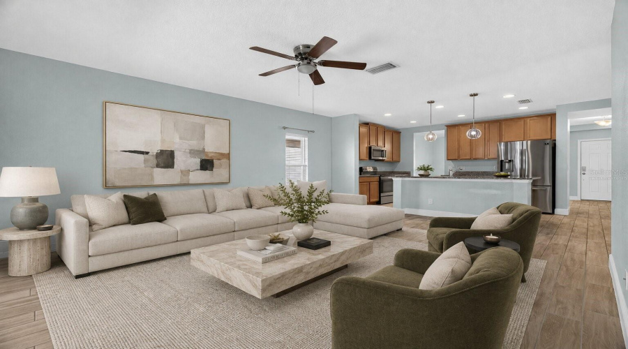 Virtually Staged Living Room With The View Of The Kitchen
