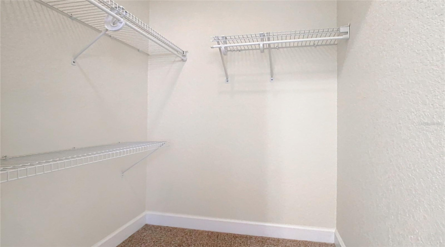 A Walk-In Closet In The Guest Bedroom.