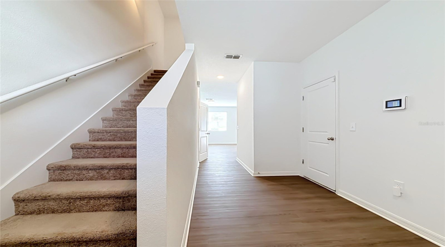 Stairs To Go Up And Garage Access To The Right