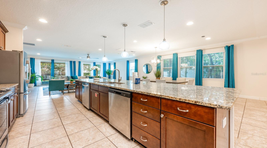 The Expansive Open-Concept Main Floor Seamlessly Blends The Living Room, Dining Area, And Chef'S Kitchen Into One Grand Gathering Space — Ideal For Hosting Large Groups With Ease.