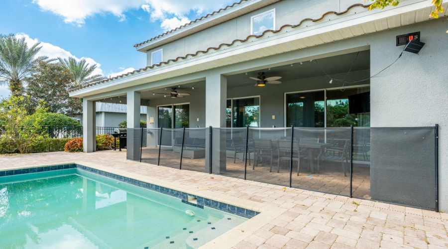 Step Outside To The Covered Paver Patio, Where A Sparkling Private Pool And Spa Await, Designed For Relaxation And Entertainment.