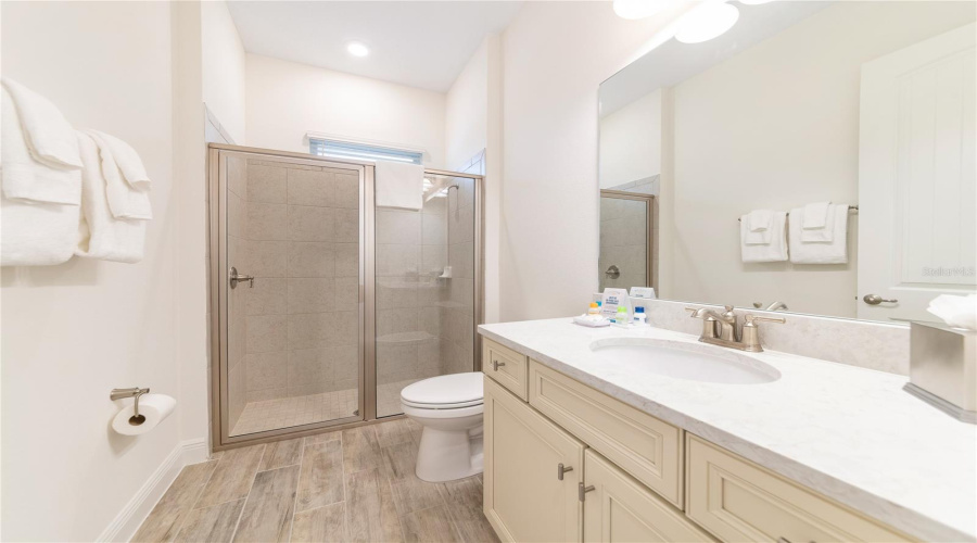 Primary Bathroom With Dual Sinks And Walk In Shower In Kissimmee Resort Style Home