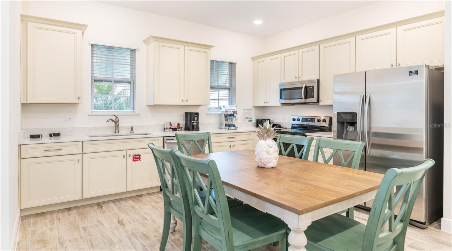 Upgraded Kitchen With Ample Cabinetry And Stainless Appliances In Kissimmee Vacation Home