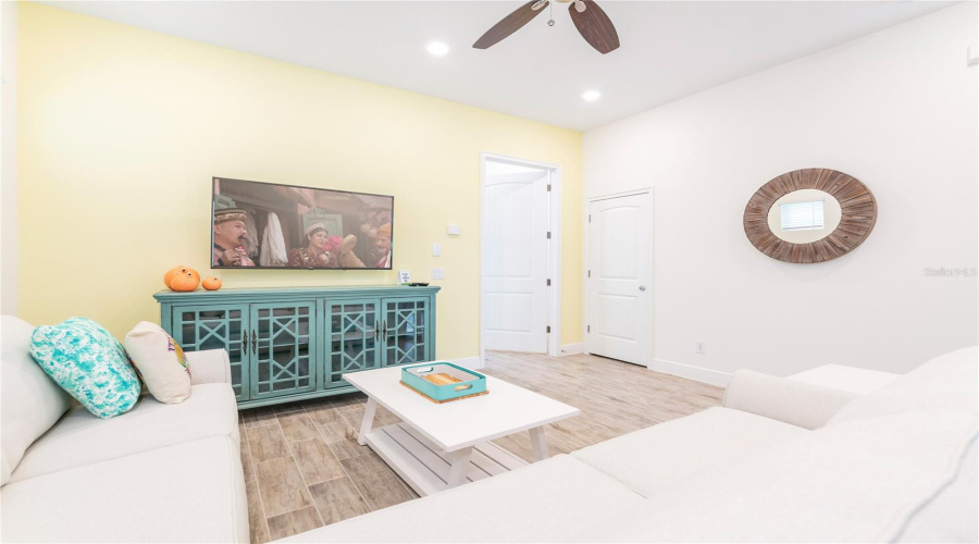Spacious Living Area With Coastal Décor And Tile Flooring In Kissimmee Short Term Rental