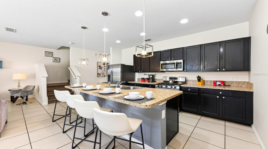 A Generous Center Island Offers Extra Prep Space And Room For Counter-Height Seating.