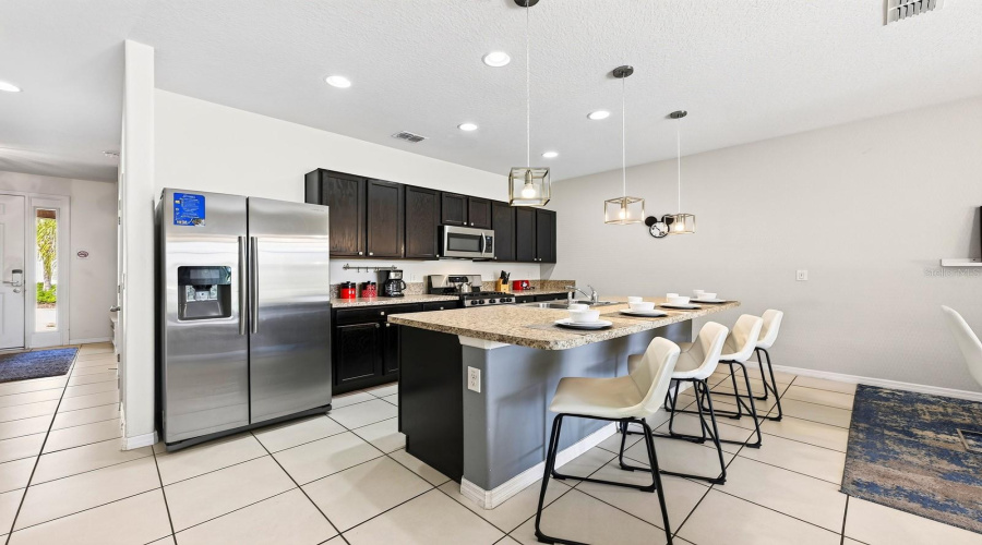 A Generous Center Island Offers Extra Prep Space And Room For Counter-Height Seating.