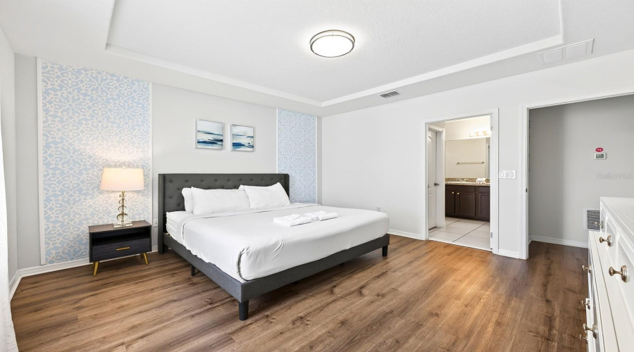The Spacious Primary Suite Offers A Relaxing Retreat With A Tray Ceiling, Walk-In Closet And Private En-Suite Bath.