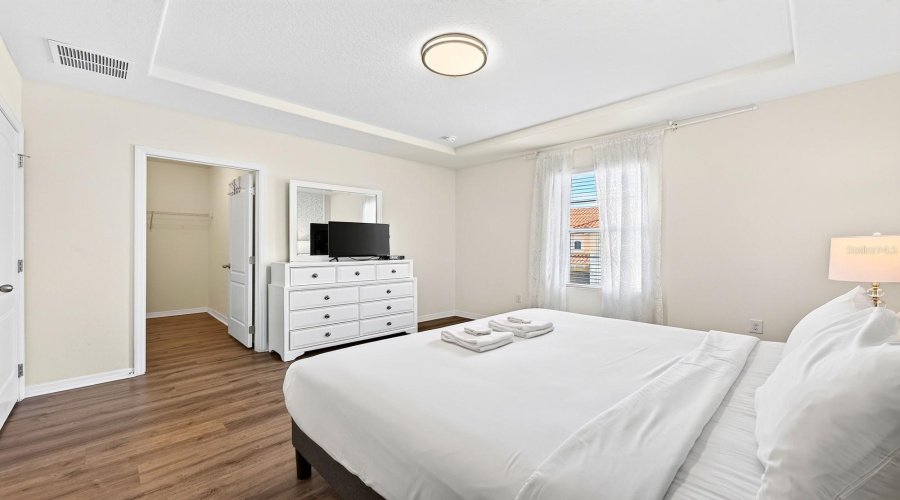 The Spacious Primary Suite Offers A Relaxing Retreat With A Tray Ceiling, Walk-In Closet And Private En-Suite Bath.