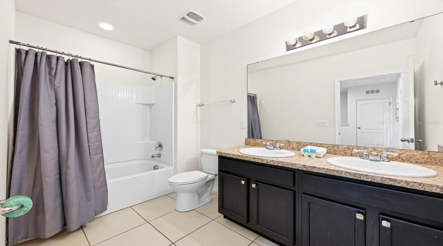 Two Additional Bedrooms Share Another Full Bath.