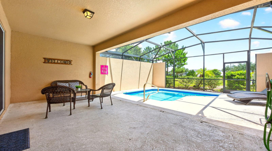 The Covered And Screened Lanai Provides A Comfortable Setting For Relaxing, Dining And Entertaining.