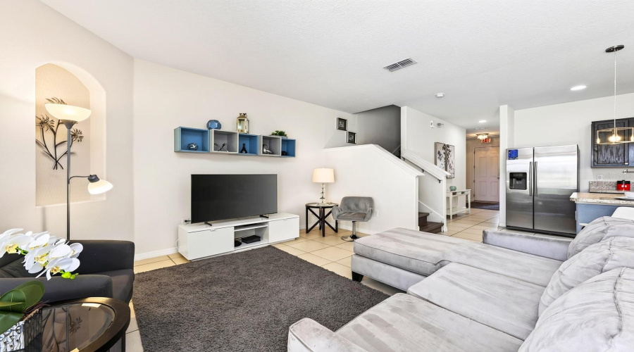Inside, The Main Floor Delivers A Bright And Spacious Open Concept Layout With The Living Room, Dining Area And Kitchen Flowing Seamlessly Together.