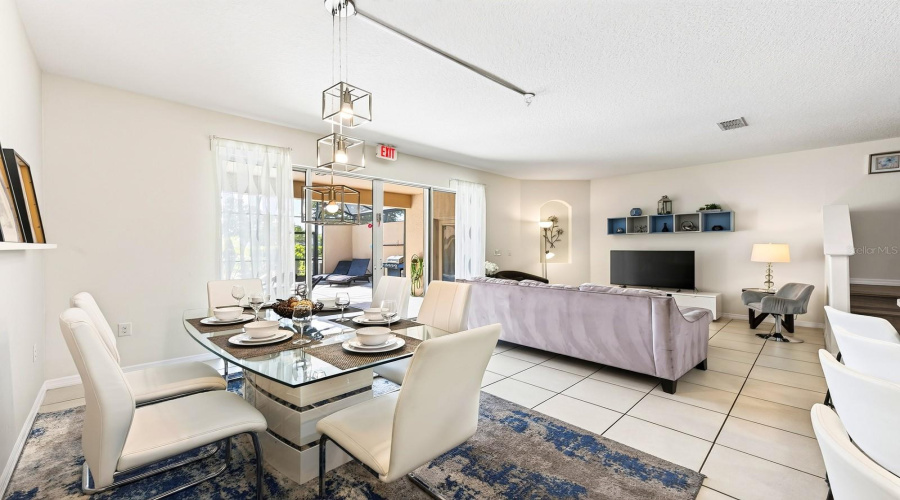 The Dining Area Sits Just Off The Kitchen And Offers Direct Access Through Sliding Glass Doors To The Outdoor Living Space.