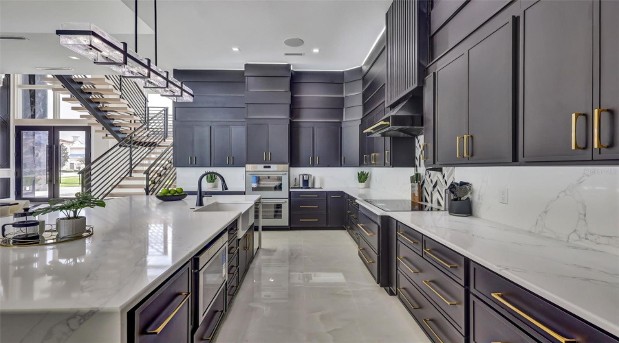 Custom Cabinetry, Quartz Surfaces And Sophisticated Designer Finishes