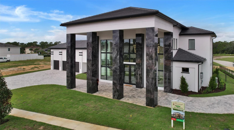 Striking Contemporary Architecture Framed By Soaring Columns And Two-Story Glass