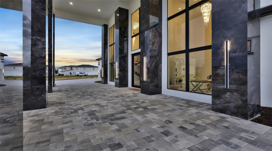 Covered Porte-Cochere For Sophisticated, Sheletered Staement Arrival