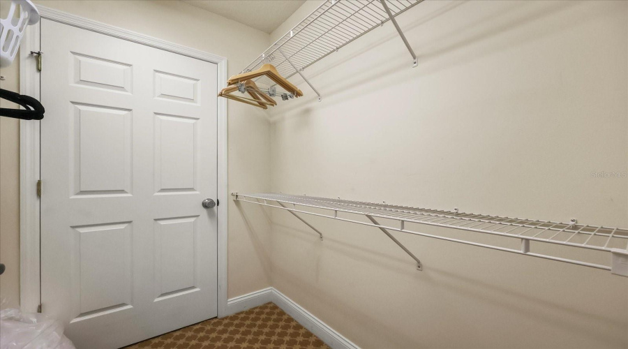 Primary Walk-In Closet With Owner'S Closet