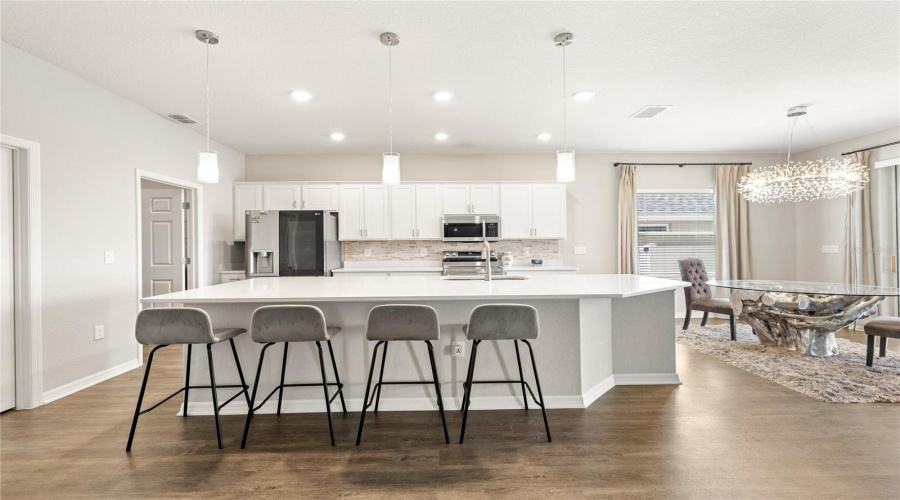 Oversized Island, Upgraded Lighting And Stainless Appliances