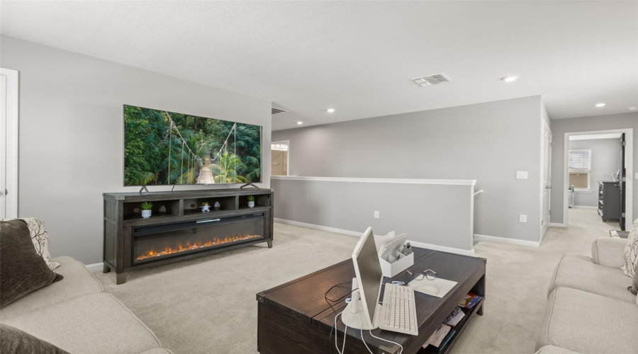 Loft Area With View To Staircase &Amp; Hall To Primary Bedroom.