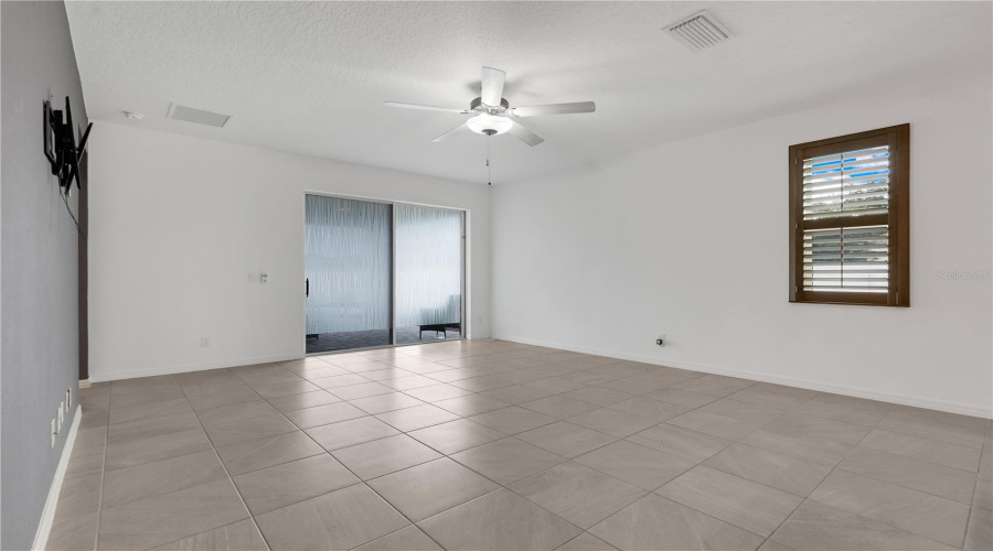 Family Room With A Sliding Door Leading To The Lanai.