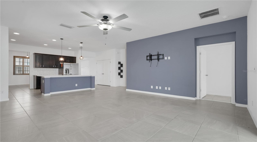 Family Room With The Kitchen And The Entrance To The Primary Bedroom.