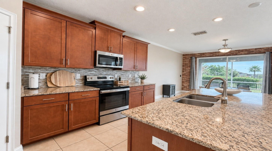 Spacious Kitchen With Plenty Of Cabinetry, Generous Counter Space And An Open Connection To The Main Living Area.
